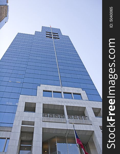 An office tower of blue glass and polished marble. An office tower of blue glass and polished marble