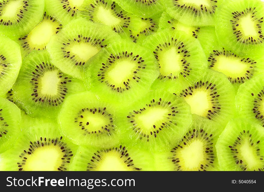 Background filled with kiwi fruit slices