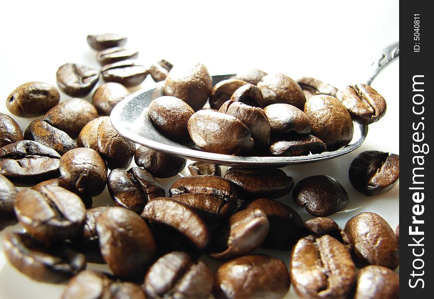 Natural coffee beans with spoon 2