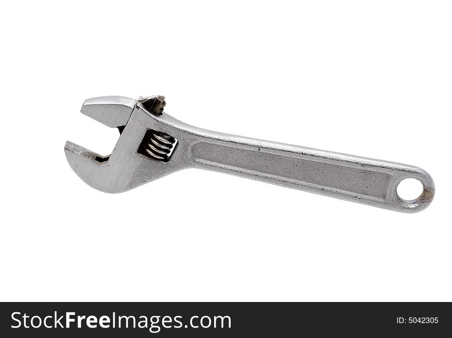 Metal wrench on white background