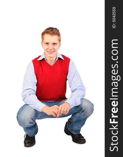 Boy in red jacket sits on white