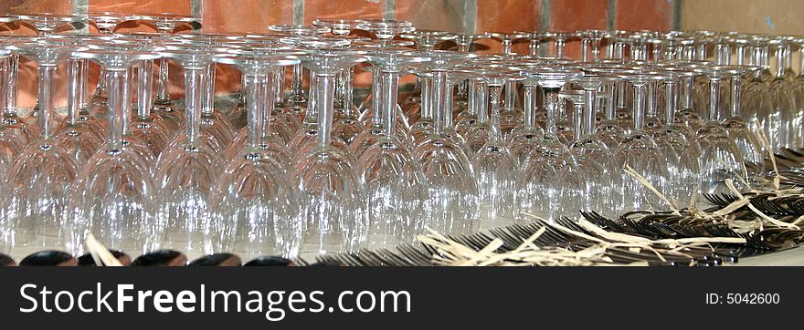 Rows of wine glasses and cutlery at a function. Rows of wine glasses and cutlery at a function