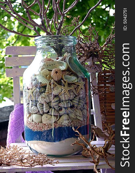 Glass jar with sea shells