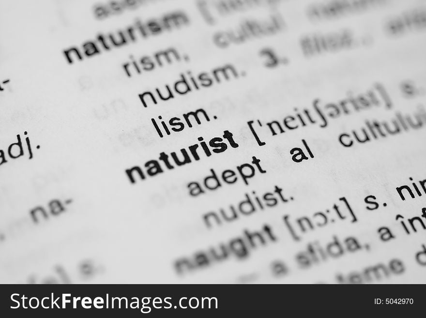 Close-up of the word naturist in a dictionary.