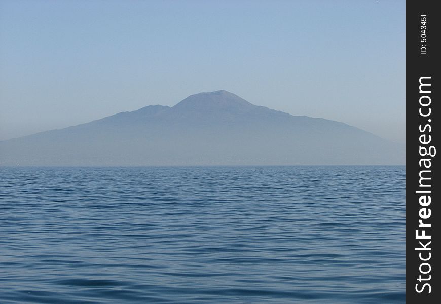 Mount Vesuvius floating in a haze over Naples