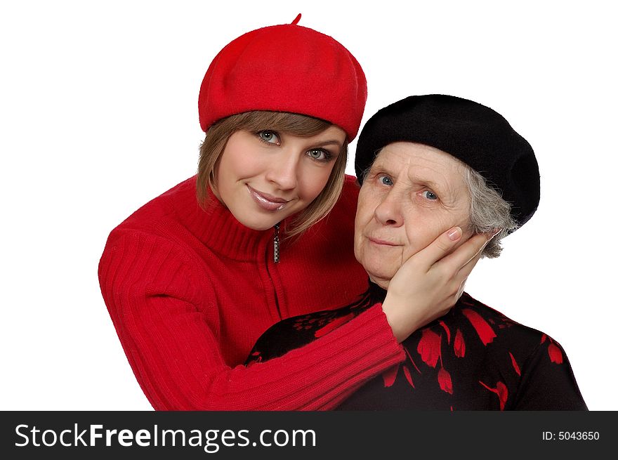 Happy grandmother and granddaughter with berets. isolated on white