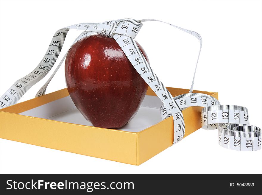 Red apple in box with tape-line. isolated on white