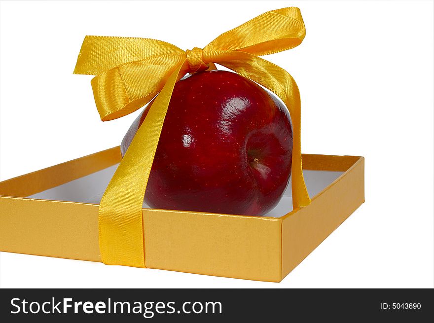 Red Apple In Box With Yellow Tape Like Gift