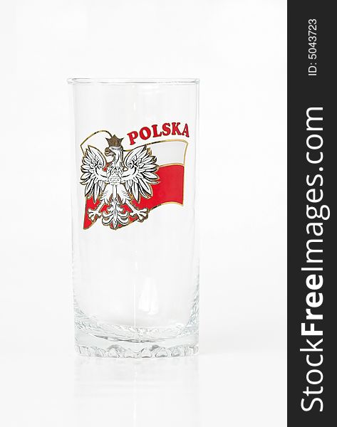 Studio isolated tall long drink glass decorated with Polish flag. Studio isolated tall long drink glass decorated with Polish flag
