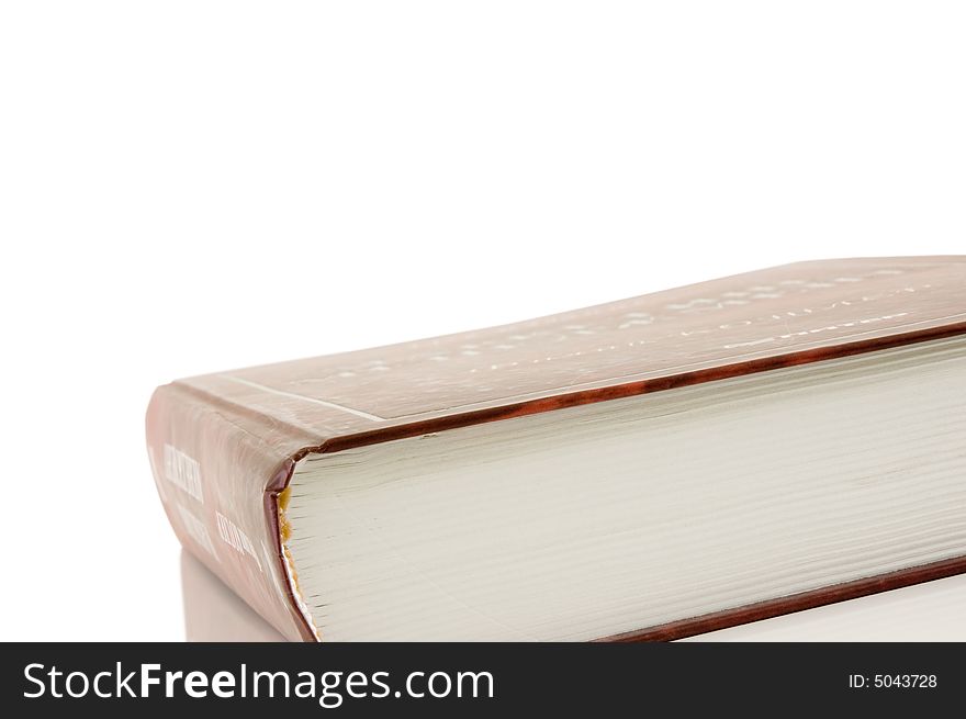 Isolated large closed book on a white background, selective focus