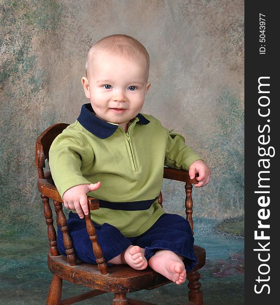 Happy Baby on Wooden Chair