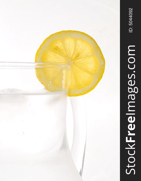 Refreshing summer drink with a slice of lemon