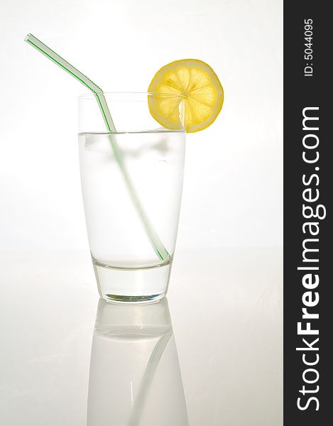 Refreshing summer drink with a slice of lemon