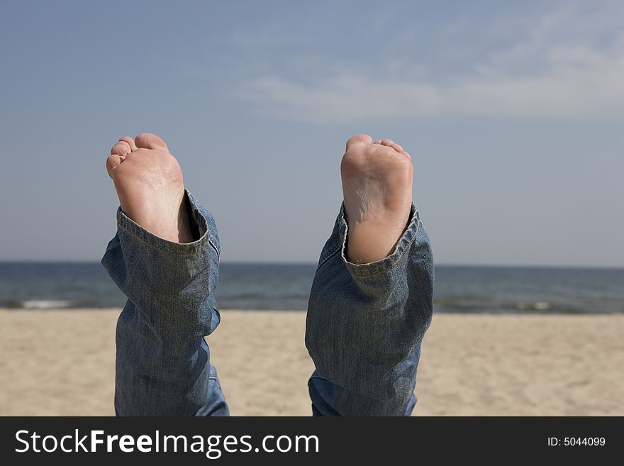 View of Bare Feet with a Backdrop of  Ocean. View of Bare Feet with a Backdrop of  Ocean
