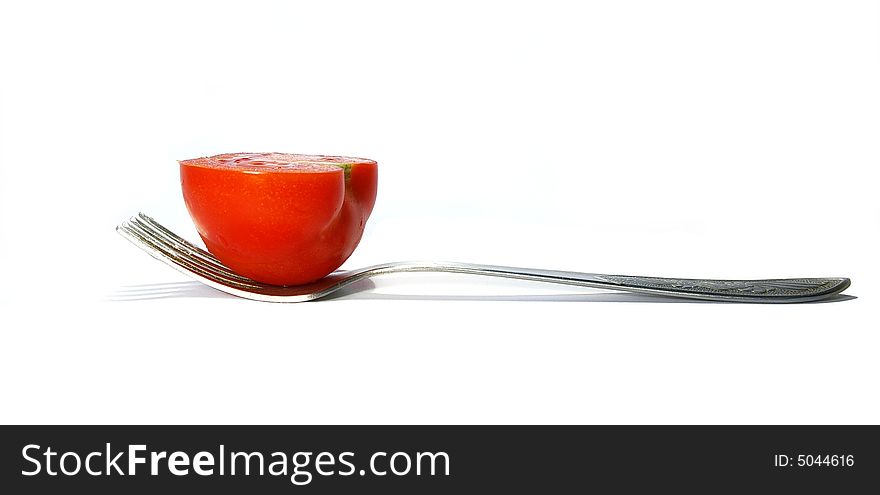 Fork and tomato isolated