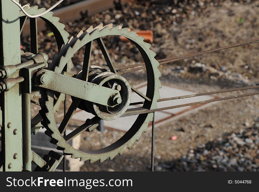 A view at a transmission wheel at an overhead line by tha railway. A view at a transmission wheel at an overhead line by tha railway.
