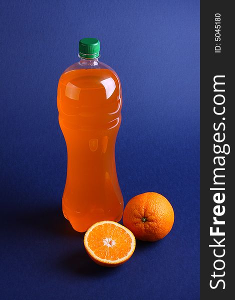 Oranges and bottle with juice. Oranges and bottle with juice