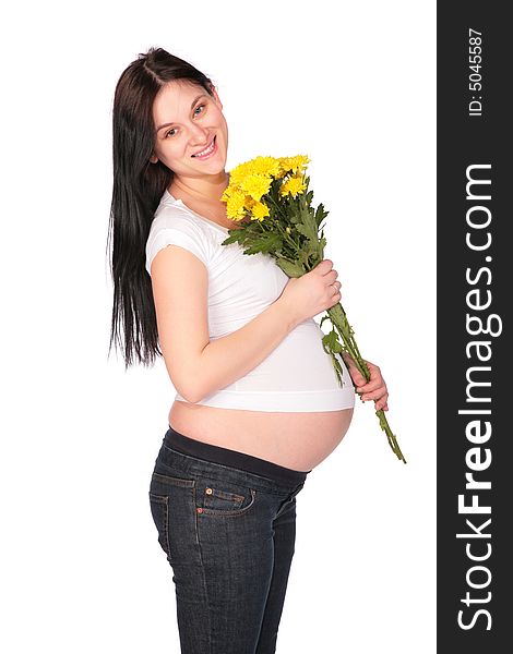 Pregnant girl with flowers on a white