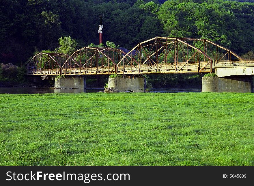 Old metal bridge over Mures River, Romania