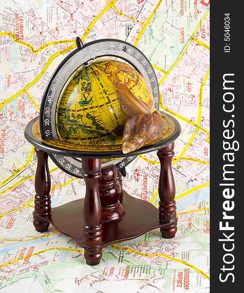 Around the world - slowly but safely - snail on the globe