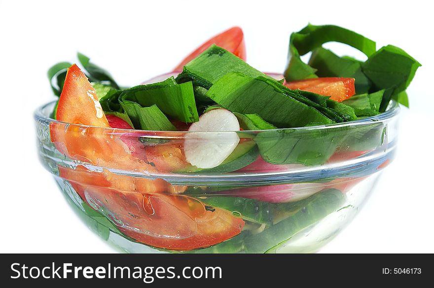 Spring salad from cucumbers, tomatoes and a garden radish. Spring salad from cucumbers, tomatoes and a garden radish