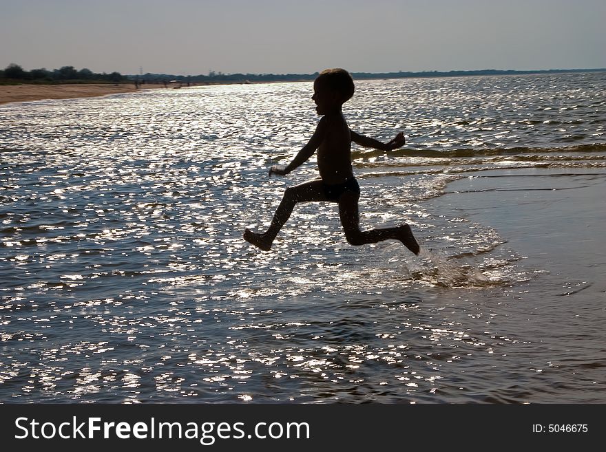 Leisure series:  a boy jumping in the sea