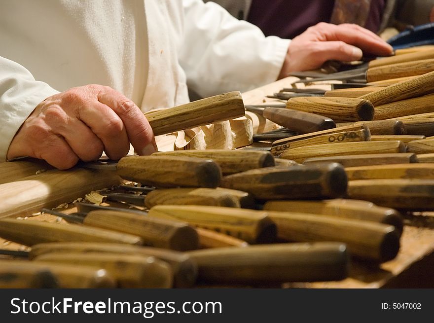 Hands of a cabinetmaker with tools. Hands of a cabinetmaker with tools