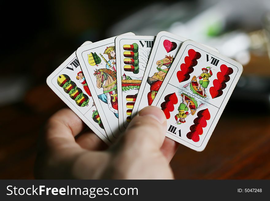 Five playing cards in hand