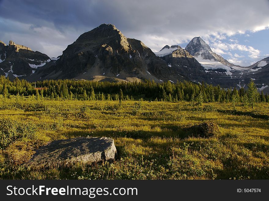 Evening light on mountain range and alpine meadow. Evening light on mountain range and alpine meadow