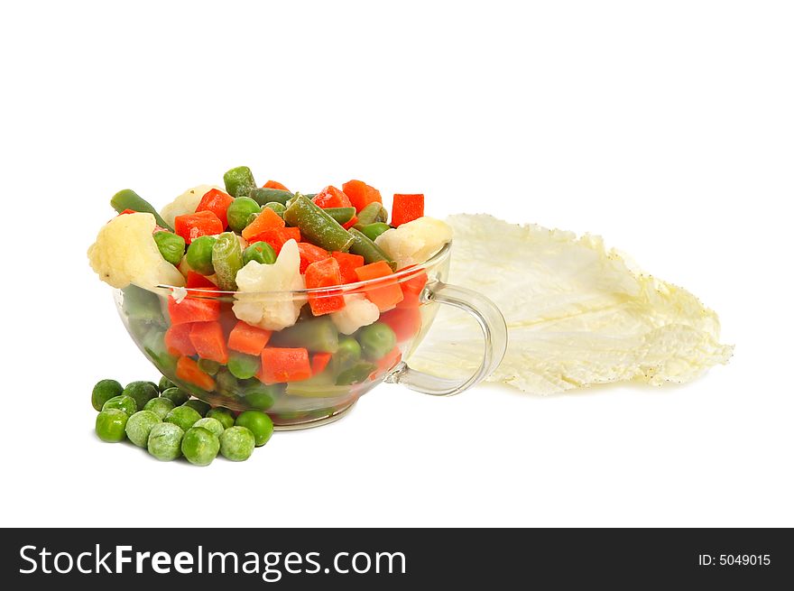 Fresh chinese lettuce leaves and different vegetables in a glass cup on white background. Fresh chinese lettuce leaves and different vegetables in a glass cup on white background