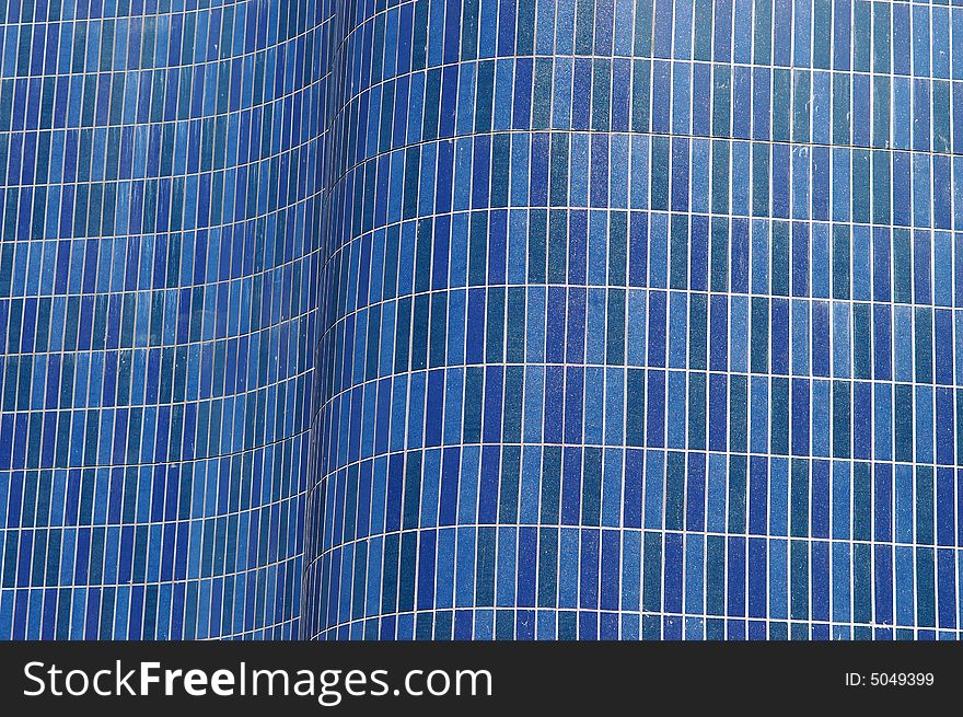 Curved wall covered with sky blue tiles