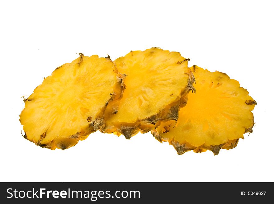 Three pineapple slices isolated on white background