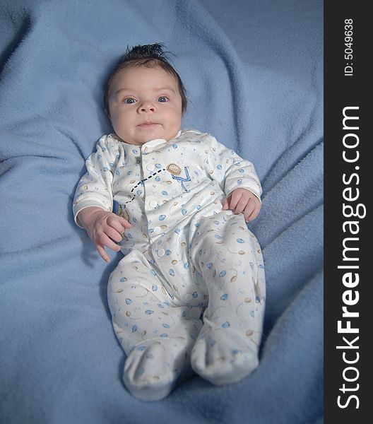 Infant on a blue background. Infant on a blue background