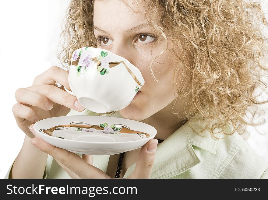 Woman drinks from a cup
