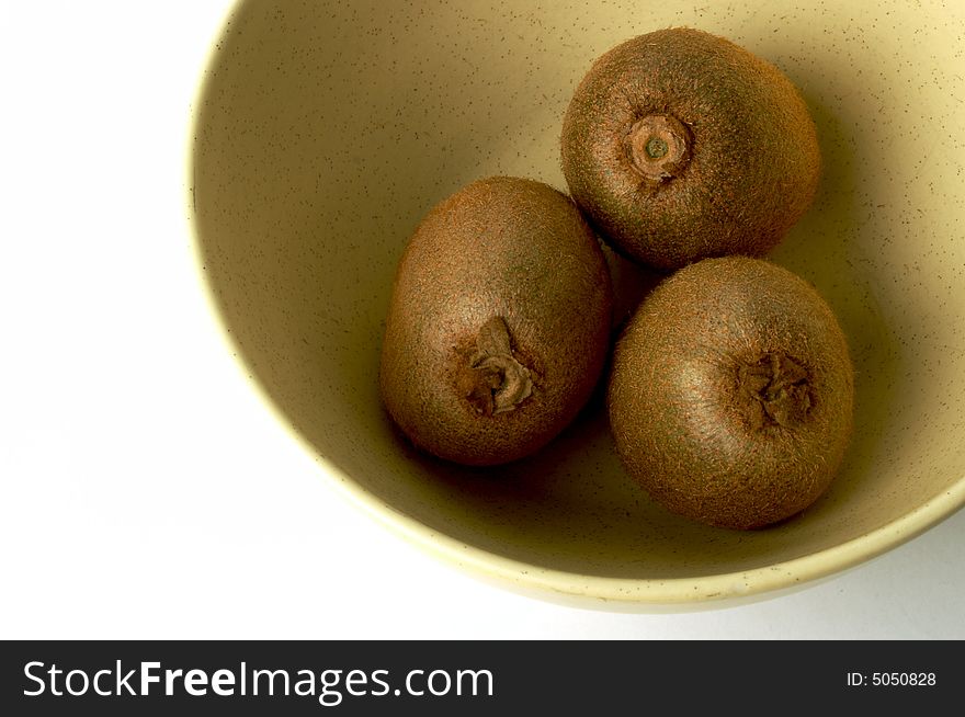 Tree kiwis in a yellow dish