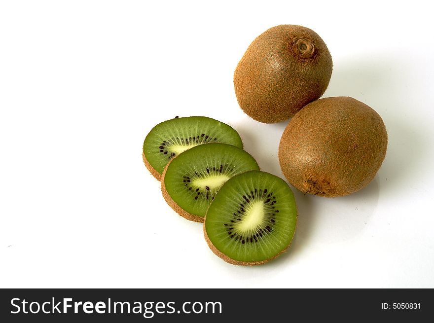 Two kiwis and tree slices