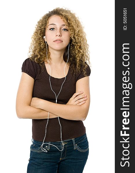 A beautiful young girl listening to music on her mp3 player. A beautiful young girl listening to music on her mp3 player