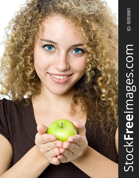 A beautiful young women holding an apple