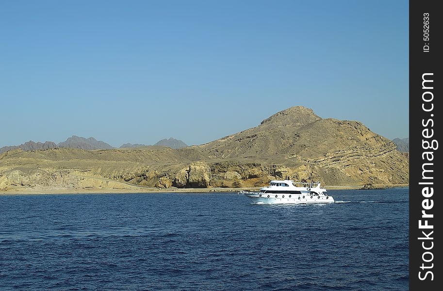 Floating boat in the Red Sea near the cost of Sharm-El-Shekh. Floating boat in the Red Sea near the cost of Sharm-El-Shekh