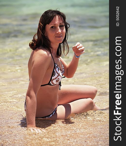 Woman enjoying the sun on vacation at Sea resort. Red Sea, Egypt