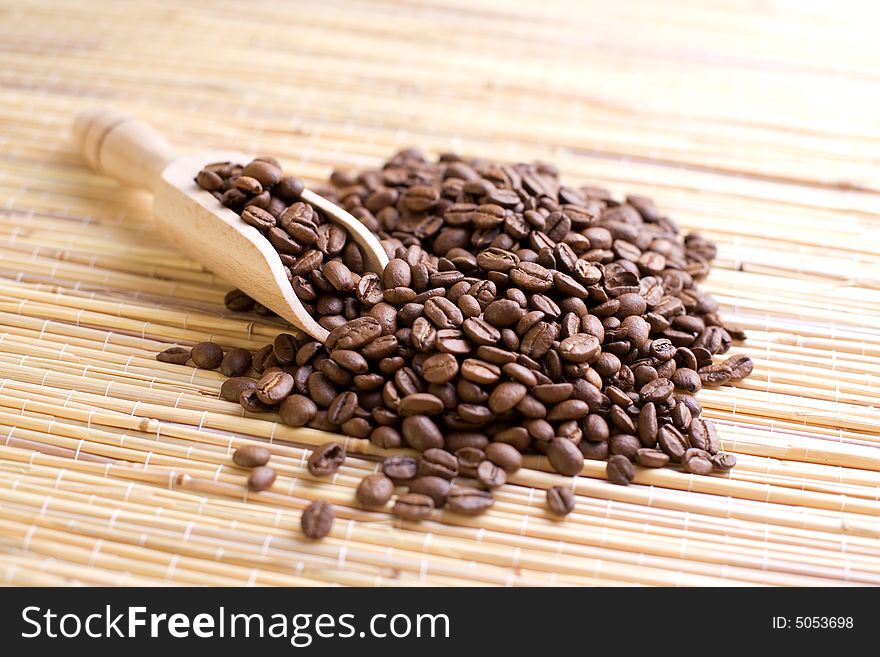 Coffee beans on the bamboo mat.