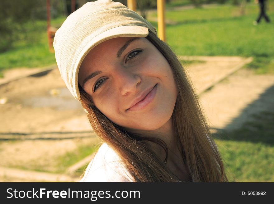 A lovely girl in the park smiling