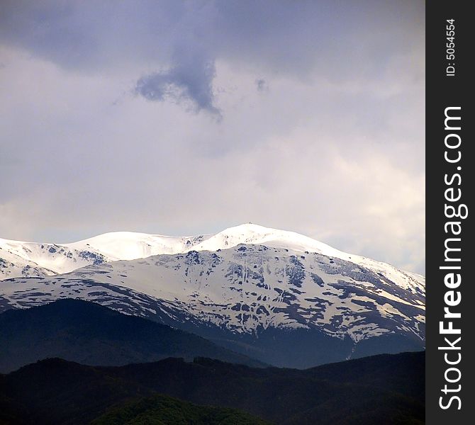 A view with snowy mountain in romania. A view with snowy mountain in romania