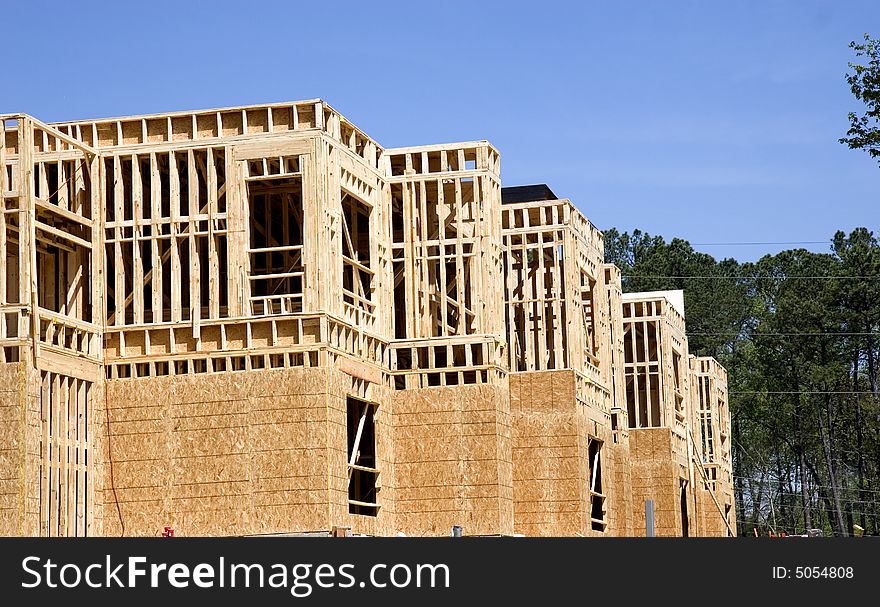 An apartment complex under new construction with wood. An apartment complex under new construction with wood