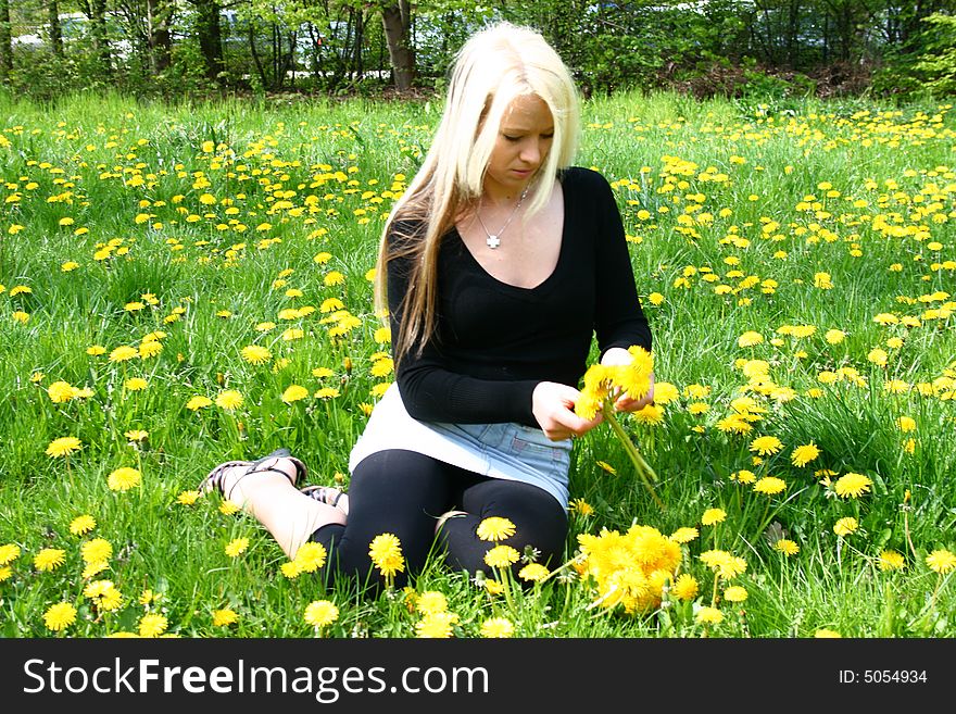 Blonde girl with yellow flower. Blonde girl with yellow flower