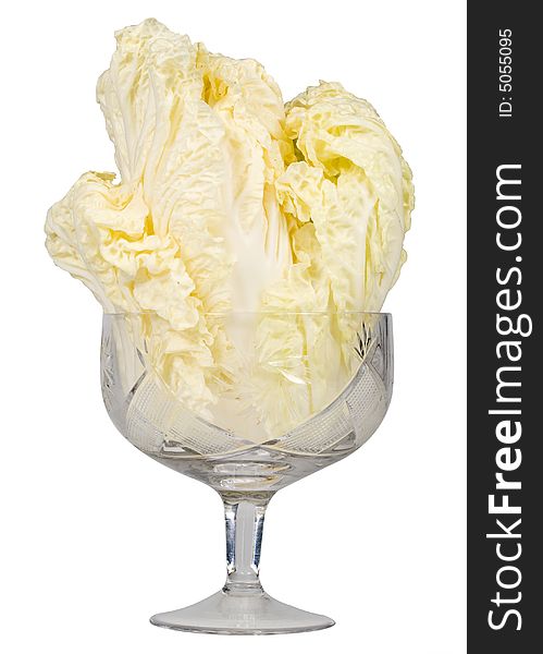 Fresh celery cabbage in a glass isolated on a white background