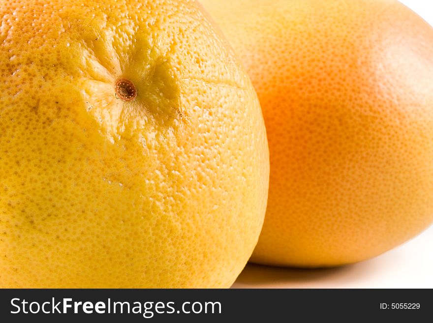 Fresh juicy grapefruit. Close up on a white background. Fresh juicy grapefruit. Close up on a white background.