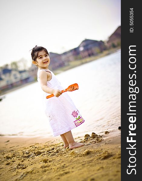 Two year old girl enjoying summer time at the bach. Two year old girl enjoying summer time at the bach