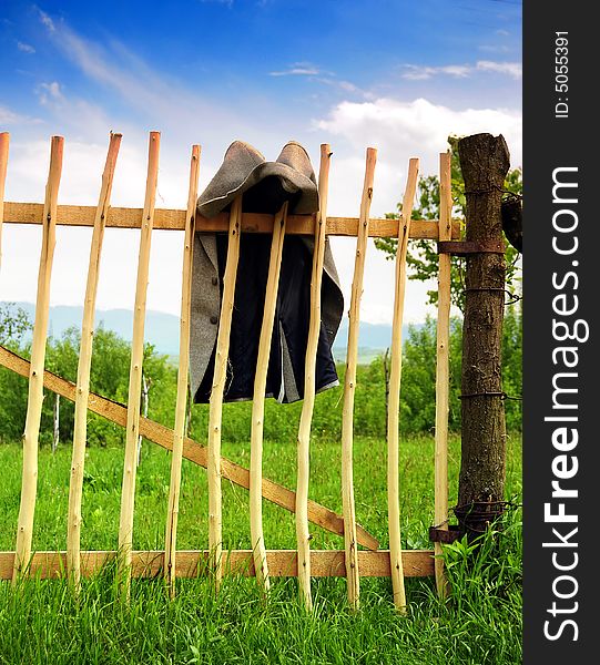 A view with a jacket on a wood fence