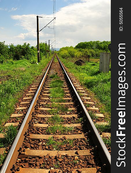 A horizontal shot of railroad tracks extending to the horizon.